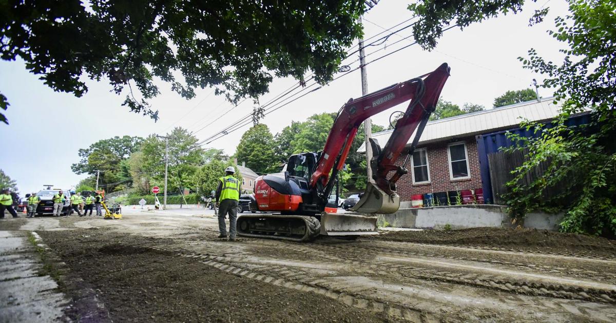 Water main break causes sidewalk, road damage