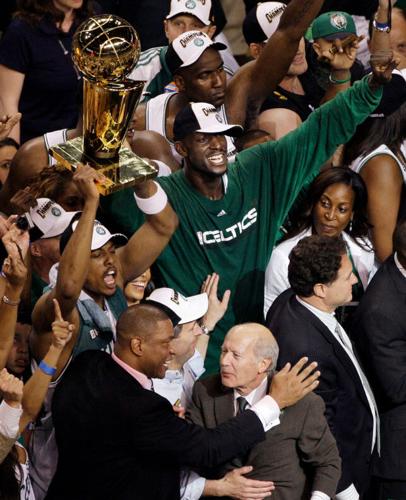 Pau Gasol embraces the NBA Championship trophy.jpg