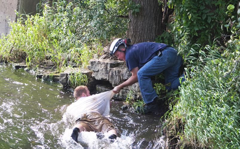 Rescue crews save man who nearly went over Vermillion River Falls ...