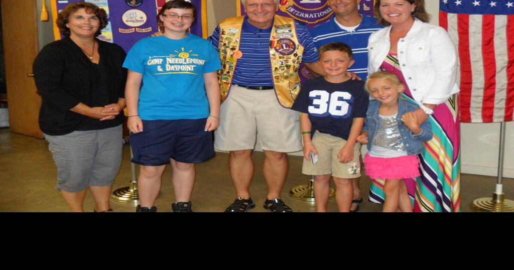 Johnson delivers Camp Needlepoint presentation to Roberts Lions