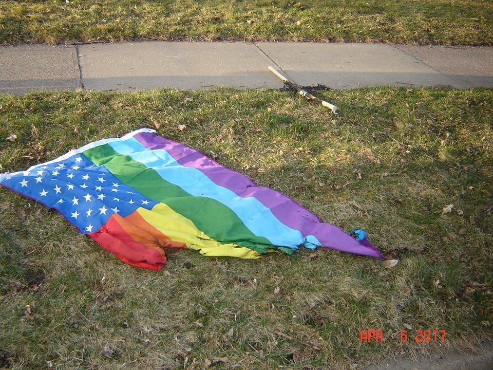 burning gay pride flag