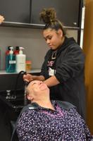 Parents are treated to lunch, salon and automotive services during event at CHS