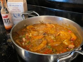 A simmering pot of shrimp