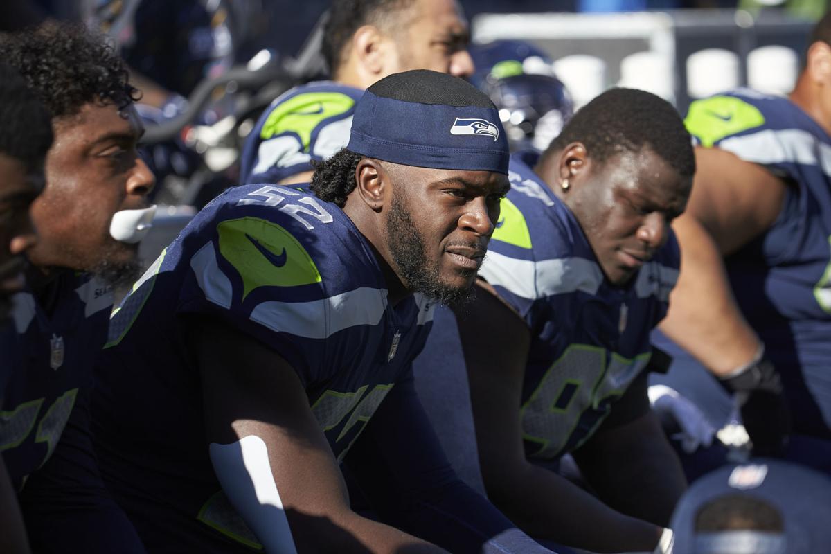 Seahawks LB Darrell Taylor runs onto the field after an