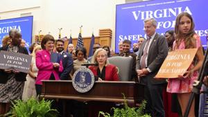 Gov. Abigail Spanberger signs a package of gun control legislation