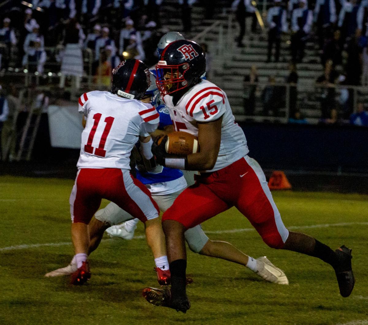 Patrick Henry at Atlee football: Berry gets a block