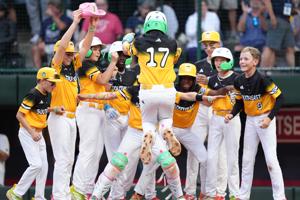 Aug 21, 2025; Williamsport, PA, USA; Brody Miller (17) of Southeast Region celebrates with teammates after hitting a home run against Mountain Region in the second inning at Howard J. Lamade Stadium. Mandatory Credit: Kyle Ross-Imagn Images