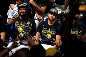 Golden State Warriors forward Kevin Durant (35) and guard Stephen Curry (30) celebrate after beating the Cleveland Cavaliers in Game 4 of the 2018 NBA Finals.