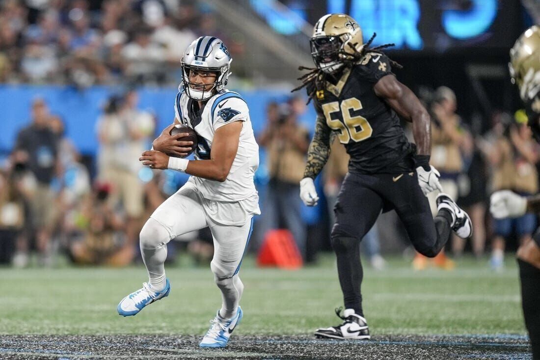 Panthers Players Lead Their Team Into The Stadium Background