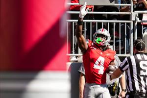 Ohio State Buckeyes wide receiver Jeremiah Smith (4) celebrates a touchdown during the NCAA football game against the Illinois