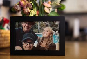 A framed picture of David Murray, Cristie Bosch, and their daughter, Scout, sits on a kitchen counter at their home Thursday, April 9, 2026, in Chicago.