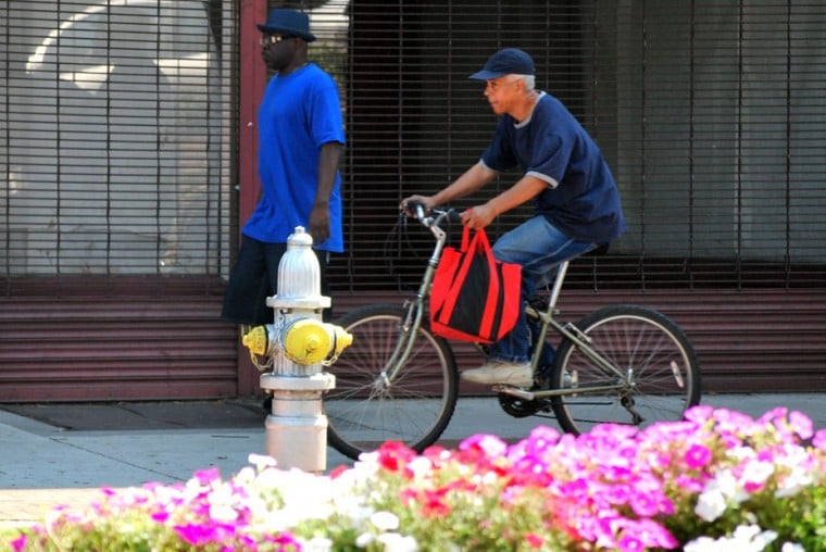 is riding a bike on the sidewalk illegal