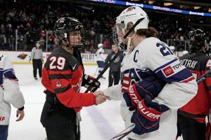 Feb 11, 2024; Saint Paul, Minnesota, USA; Team Canada forward Marie-Philip Poulin (29) and Team USA forward Hilary Knight (21) shake hands after a Rivalry Series women's ice hockey game at Xcel Energy Center. Mandatory Credit: Nick Wosika-USA TODAY S