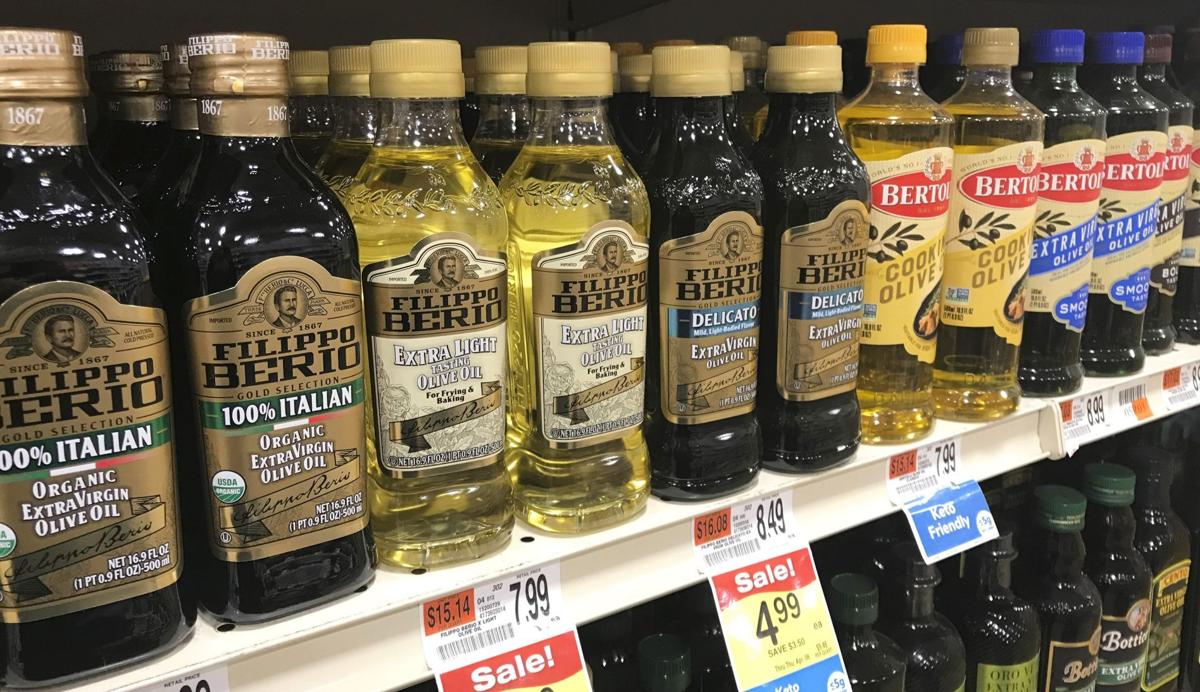 Closeup of olive oils on shelf