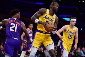 Los Angeles Lakers center DeAndre Ayton (5) gets the rebound against the Phoenix Suns during the first half at Crypto.com Arena on Dec. 1, 2025.
