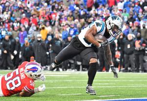 Dec 19, 2021; Orchard Park, New York, USA; Carolina Panthers running back Ameer Abdullah (20) outruns Buffalo Bills outside linebacker Matt Milano (58) to score a touchdown in the fourth quarter at Highmark Stadium. Mandatory Credit: Mark Konezny-USA