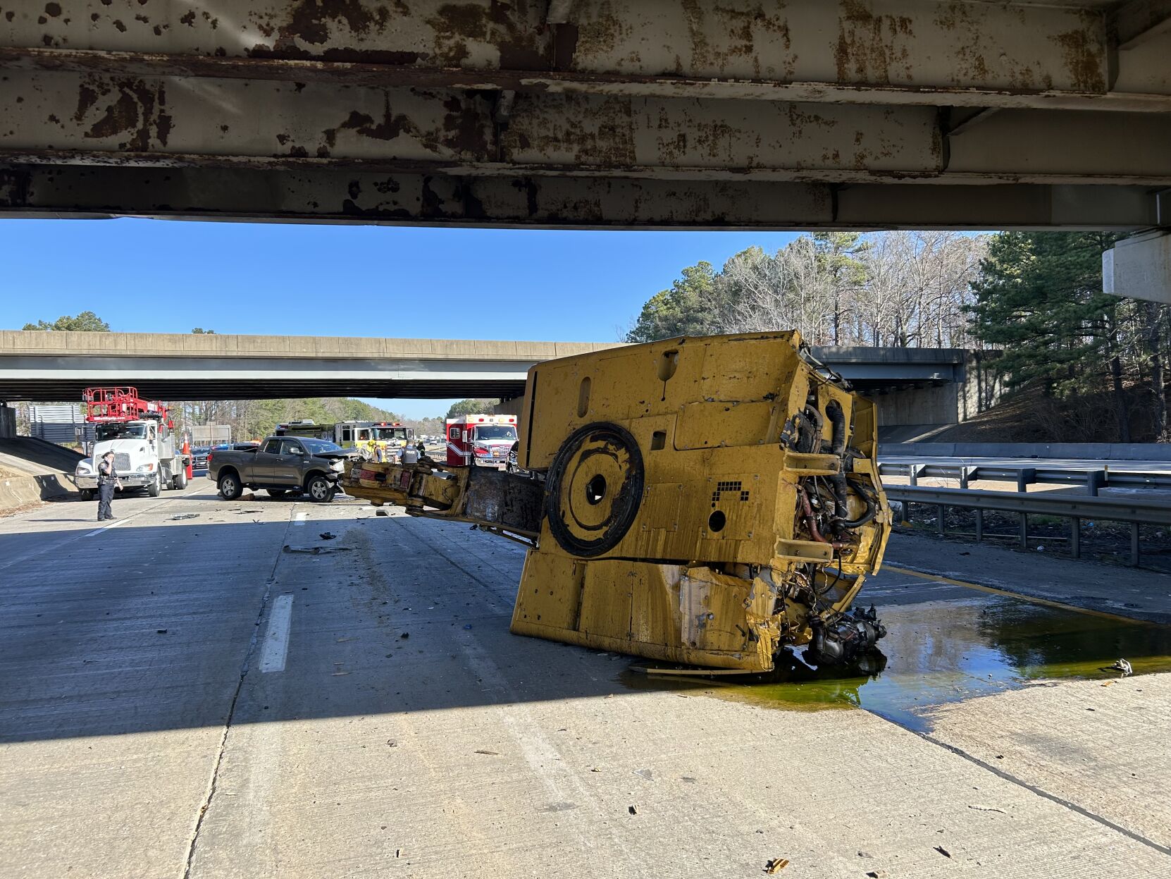 Excavator seen with other vehicles behind it