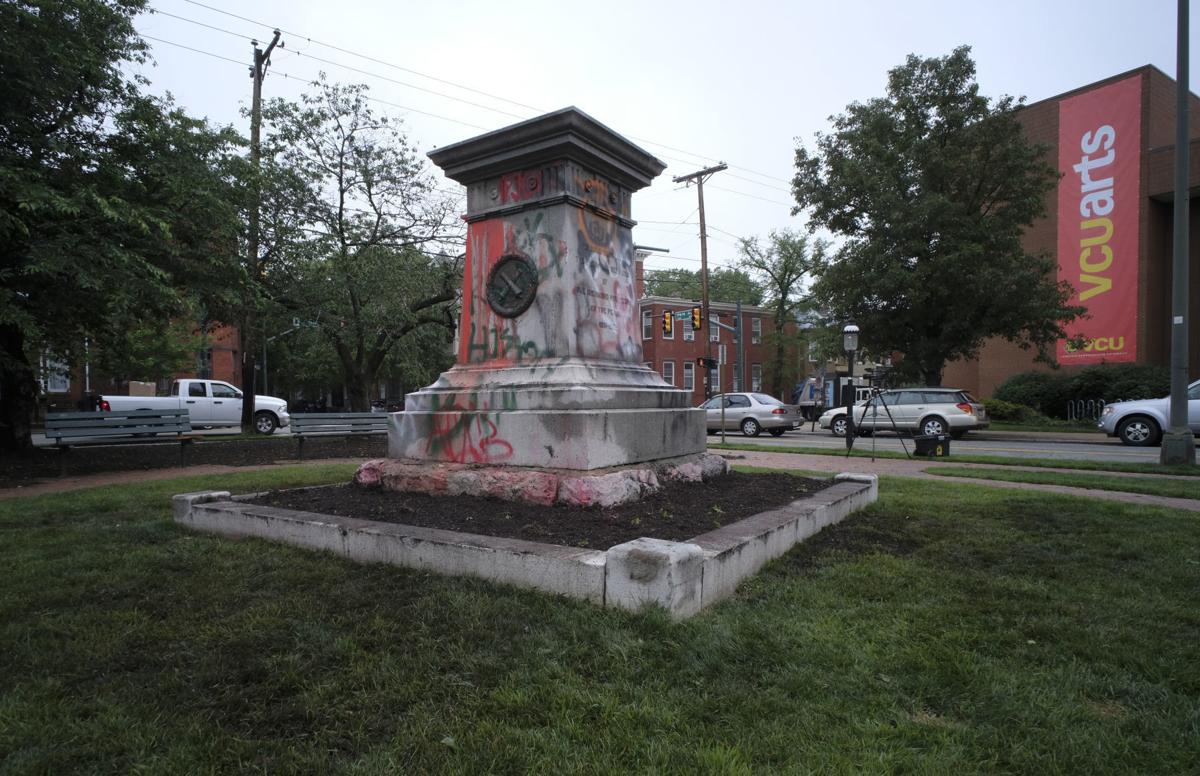 Richmond statues fall loudly, but are taken away quietly to be kept in
