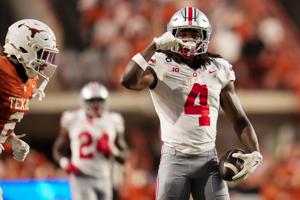 Ohio State Buckeyes wide receiver Jeremiah Smith (4) celebrates a catch during the NCAA football game against the Texas