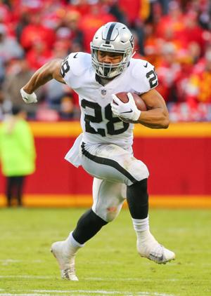 Oakland Raiders running back Doug Martin (28) runs against the Kansas City Chiefs at Arrowhead Stadium.