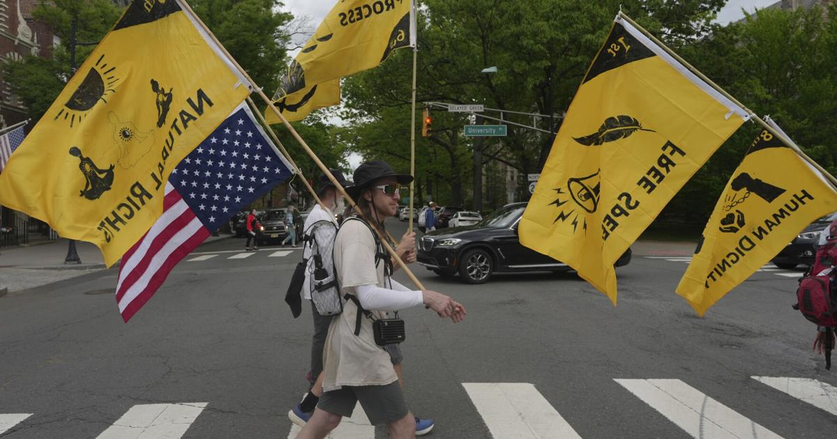 Quakers march against Trump's crackdown on immigrants, carrying on long ...