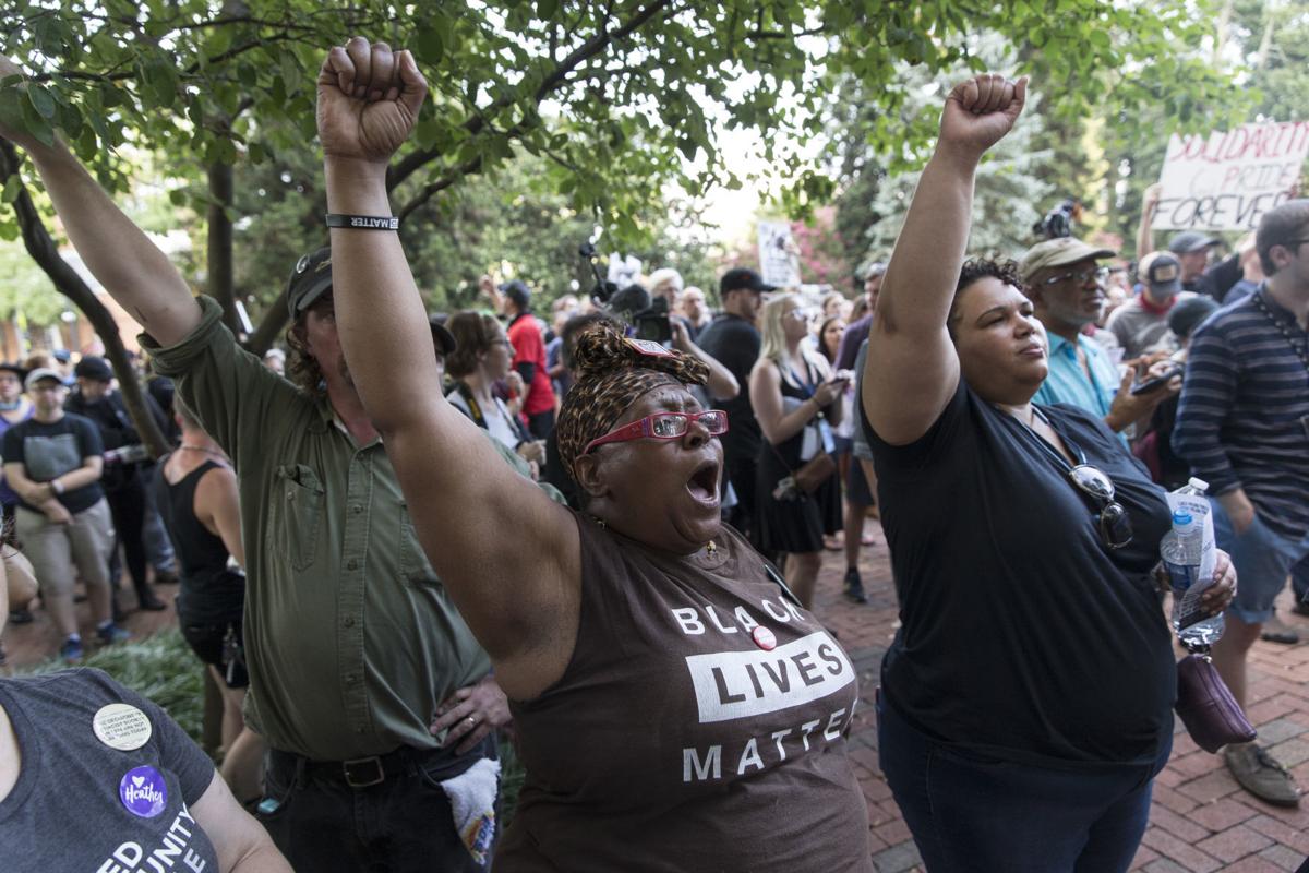 Hundreds march peacefully in Charlottesville to protest last year's