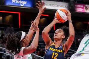Indiana Fever forward Damiris Dantas (12) goes up for a basket against Nigeria’s Vera Ojenuwa (12) on Saturday, May 2, 2026, during the first half of a preseason game at Gainbridge Fieldhouse in Indianapolis.