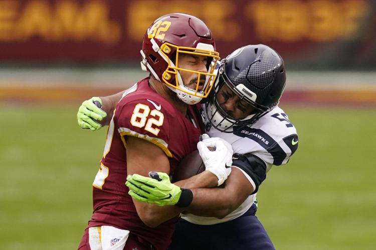 Daron Payne sacks Russell Wilson for 9-yard loss on first play of second  half