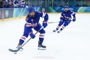 Haley Winn (8) of the United States looks to pass during the first period against Sweden in a women's ice hockey semifinal during the Milano Cortina 2026 Olympic Winter Games at Milano Santagiulia Ice Hockey Arena on Feb 16, 2026 in Milan, Italy.