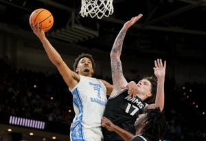 North Carolina guard Seth Trimble drives to the basket in a 2026 men's NCAA Tournament first-round game against VCU.
