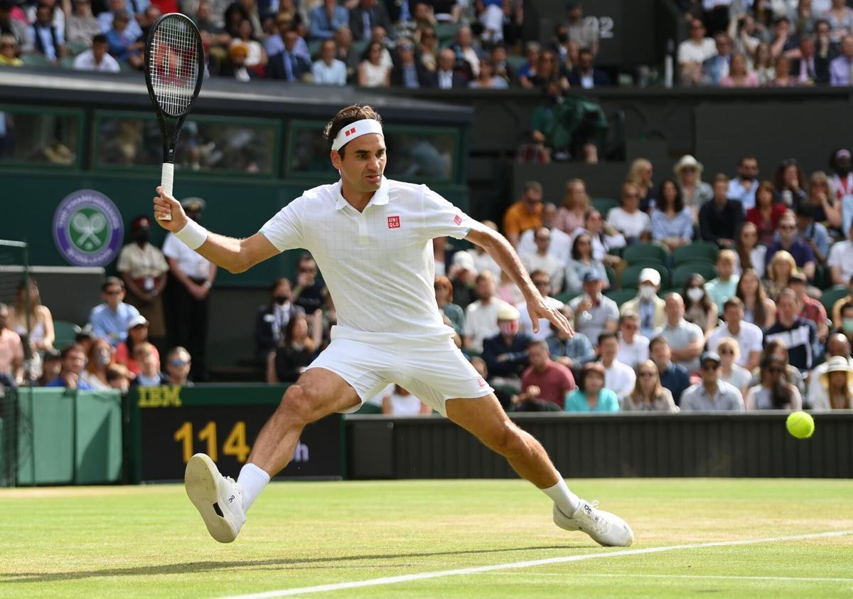 Roger Federer of Switzerland plays a forehand during his third-round match against Cameron Norrie of Great Britain during Wimbledon at All England Lawn Tennis and Croquet Club on Saturday, July 3, 2021 in London.