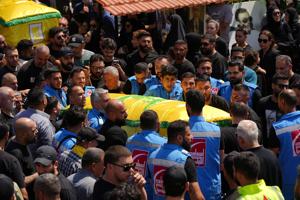 Mourners attend the funeral of two Hezbollah fighters, who were killed before an interim deal between the U.S. and Iran in Nabatieh