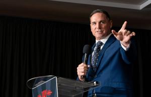 Jay Feely celebrates his victory in the 1st Congressional District GOP primary during a party at Hilton Garden Inn in Scottsdale
