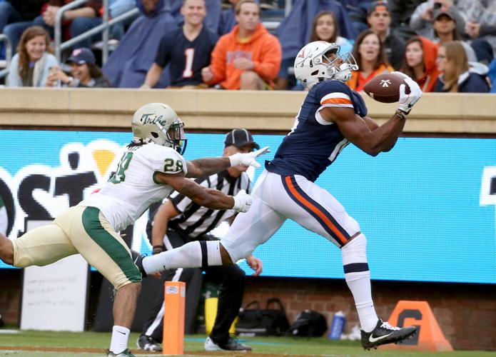 MIAMI GARDENS, FL - NOVEMBER 18: Virginia Cavaliers Wide Receiver Andre  Levrone (14) catches a ball on the field before the start of the college  football game between the Virginia Cavaliers and