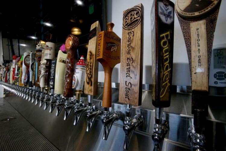 Beer flowing fast at new Growlers to Go store