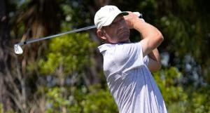 George McNeill of Fort Myers, Florida, watches his tee shot on the par three, 6th hole. The second round of the Senior PGA