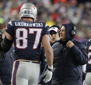 Patriots head coach Bill Belichick talks with tight end Rob Gronkowski in the first half as the New England Patriots host the Pittsburgh Steelers at Gillette Stadium.