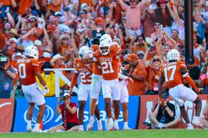 Oct 11, 2025; Dallas, Texas, USA; Texas Longhorns defensive back Ryan Niblett (21) celebrates with teammates after returning a punt for a touchdown during the second half against the Oklahoma Sooners at the Cotton Bowl. Mandatory Credit: Kevin Jairaj