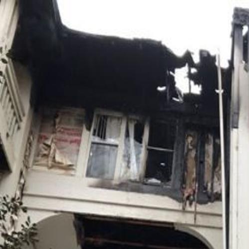 Fireplace Ashes Placed On Balcony In Plastic Container Sparked