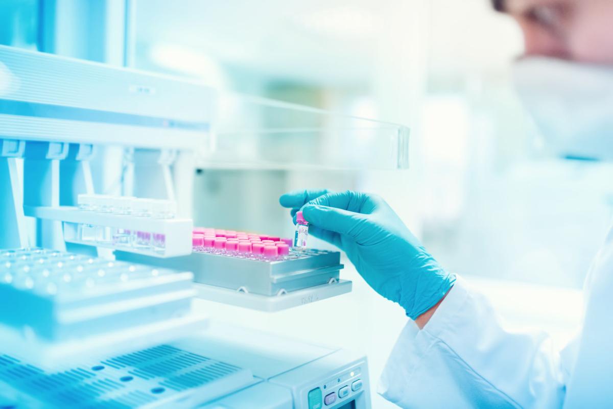 Chemist holding sample