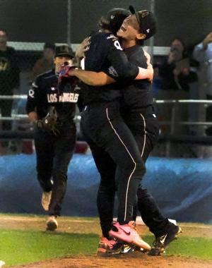 Los Angeles Queens' Ayami Sato, right gets a hug from teammate Ashton Landsdell after they defeated the San Francisco Firebells at the Women's Pro Baseball League championship series Game 5 Tuesday Sept. 22 2026.