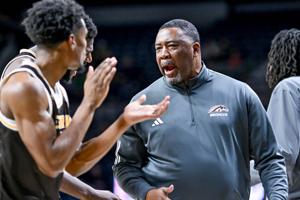 Dec 5, 2023; South Bend, Indiana, USA; Western Michigan Broncos head coach Dwayne Stephens talks to his players in the first half against the Notre Dame Fighting Irish at the Purcell Pavilion. Mandatory Credit: Matt Cashore-USA TODAY Sports