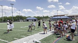 Riverside celebrates with the Class 5 girls lacrosse state championship trophy