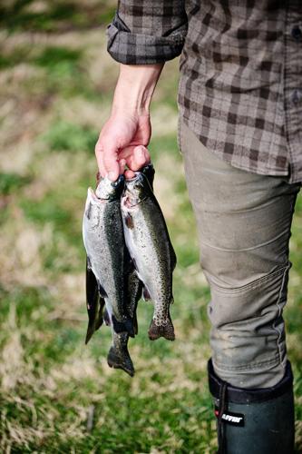 Smoke in Chimneys: Ty Walker holding fish