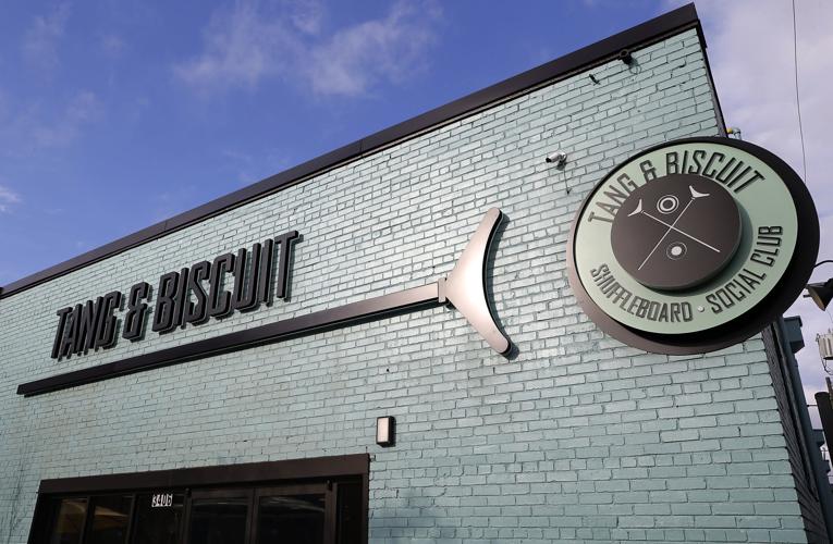 Restaurant review Tang & Biscuit serves biscuitbased menu with shuffleboard in Scott's Addition