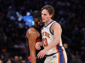 Phoenix Suns guard Jordan Goodwin (23) closely defends New York Knicks guard Tyler Kolek (13) during the second half at Madison Square Garden in Phoenix, on Jan. 17, 2026.