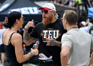 San Francisco 49ers tight end George Kittle, and founder of Tight End University talks with his wife Claire Kittle during the