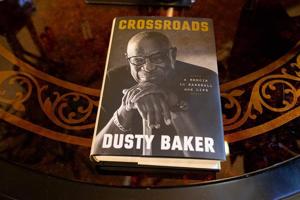 The book chronicles Baker's journey in baseball, from signing with the Atlanta Braves in 1968 against his father's wishes to being mentored by Hank Aaron, winning the 1981 World Series as a player, and capturing the 2022 World Series title as a manag