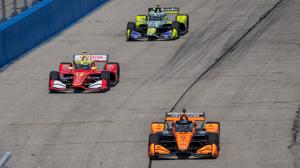 Pato O'Ward leads David Malukas (12) and Christian Rasmussen (21) into turn one during the Snap-on Milwaukee Mile 250 Sunday,