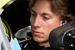 NASCAR Cup Series driver Carson Hocevar (77) sits in his car Saturday, July 25, 2026, during qualifying for the Brickyard 400 at